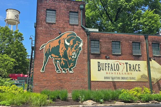 Guide pouring bourbon samples for guests on a Buffalo Trace distillery tour day trip run by B&C from Louisville