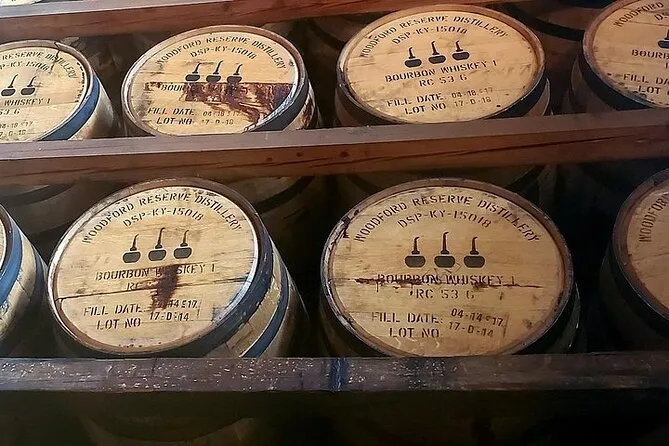 Bourbon tasting glasses lined up on a barrel during a Buffalo Trace distillery tour combination day from Louisville